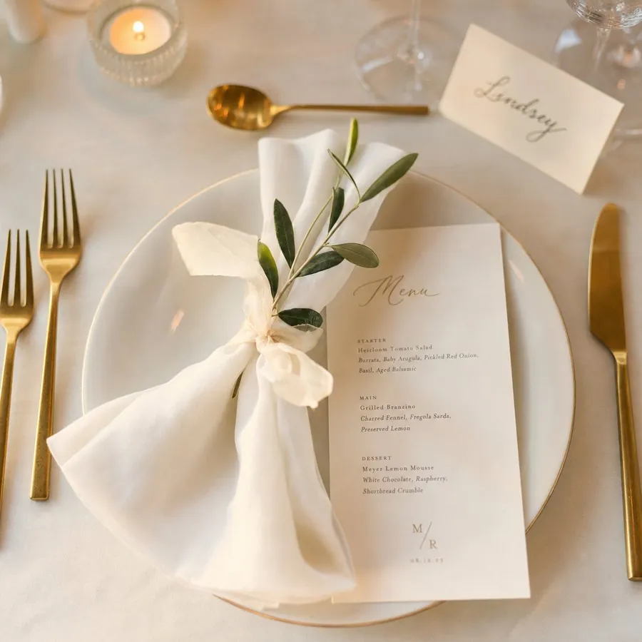 A place setting with a printed menu and name card at a reception